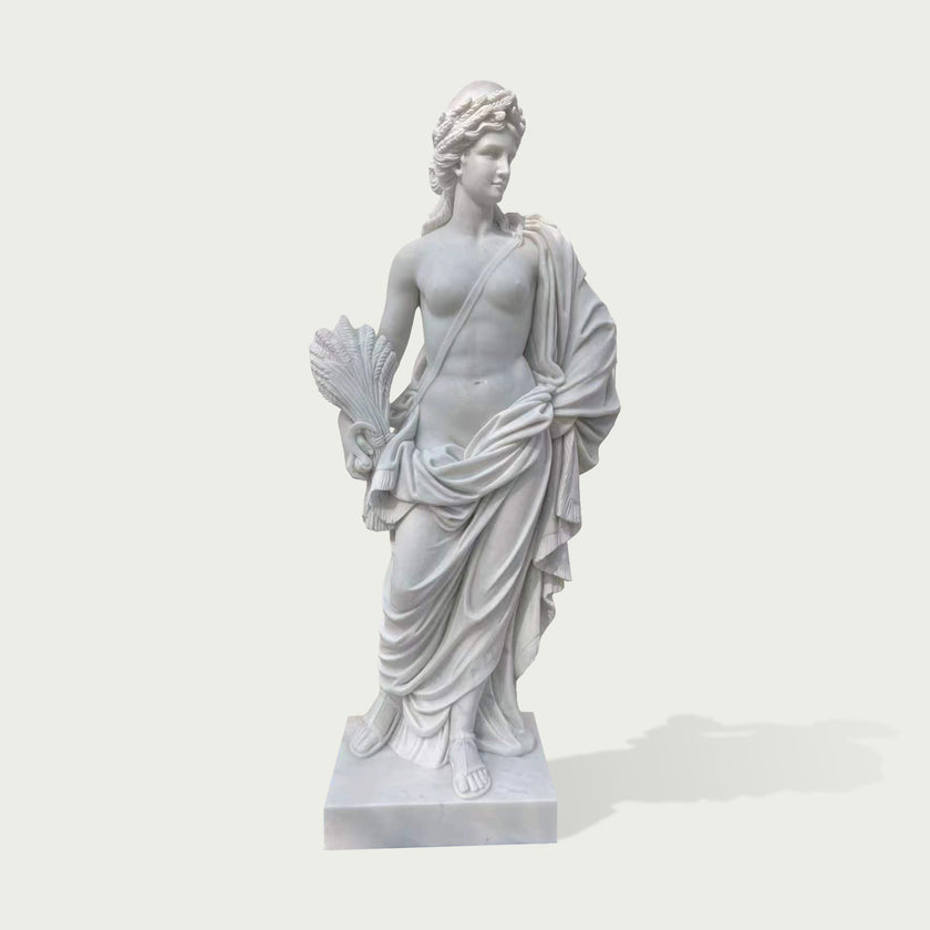 White marble classical female sculpture featuring flowing fabric, ancient Greek inspired design and detailed craftsmanship for outdoor garden decoration.