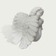 White marble cherub angel sculpture showing detailed feathered wings and peaceful sleeping pose with classical handcrafted stone carving.