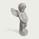 Side view of a white marble cherub angel statue showing detailed wing carving, curly hair, standing child figure, and elegant stone craftsmanship.