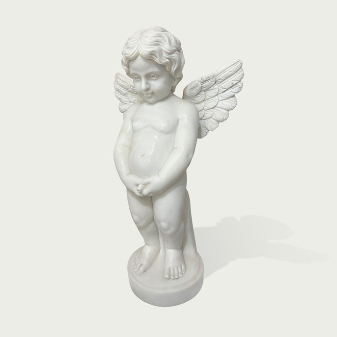 Front view of a white marble angel child sculpture with feathered wings, smooth carved details, rounded base, and peaceful classical decorative style.
