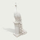 White marble peacock statue profile view with carved feather layers, slender neck, detailed crest, and elegant pedestal base for garden decor.