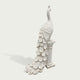 White marble peacock statue standing on a classical pedestal, featuring intricately carved layered feathers, elegant neck details, and long decorative tail.