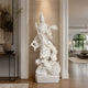 White marble Guanyin statue riding a dragon displayed in a luxury interior space, featuring detailed carving, elegant religious symbolism, and classical decor style.