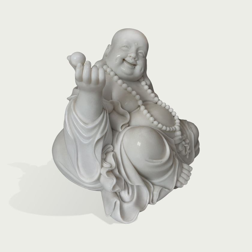 White marble Laughing Buddha statue sculpture featuring a joyful Maitreya Buddha design, detailed robe folds, prayer beads, round belly, and handcrafted stone carving.