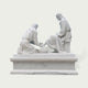 Rear view of a white marble biblical Jesus washing feet sculpture highlighting carved robes, seated figures, pedestal details and traditional marble artistry.
