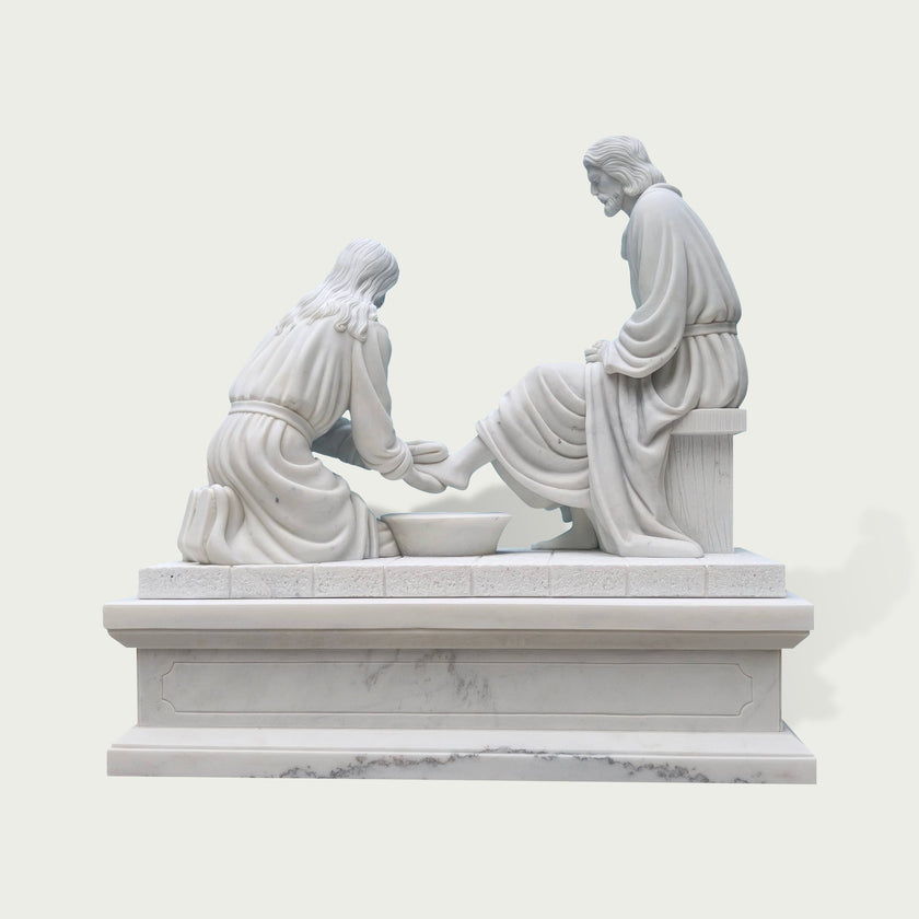 Rear view of a white marble biblical Jesus washing feet sculpture highlighting carved robes, seated figures, pedestal details and traditional marble artistry.