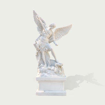 Front view of white marble Saint Michael the Archangel statue with spread wings, sword, armor, dragon sculpture base and classical religious design.