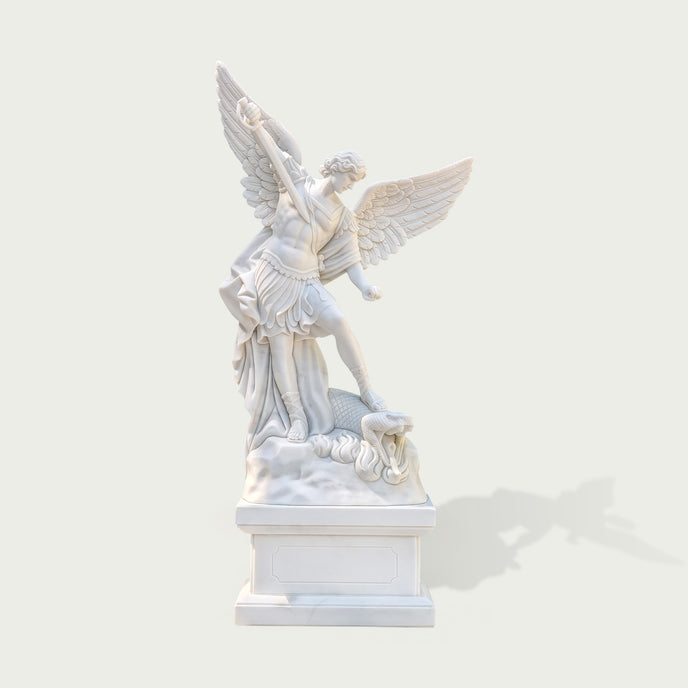Front view of white marble Saint Michael the Archangel statue with spread wings, sword, armor, dragon sculpture base and classical religious design.