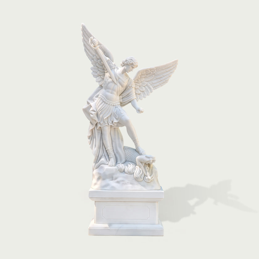 Front view of white marble Saint Michael the Archangel statue with spread wings, sword, armor, dragon sculpture base and classical religious design.