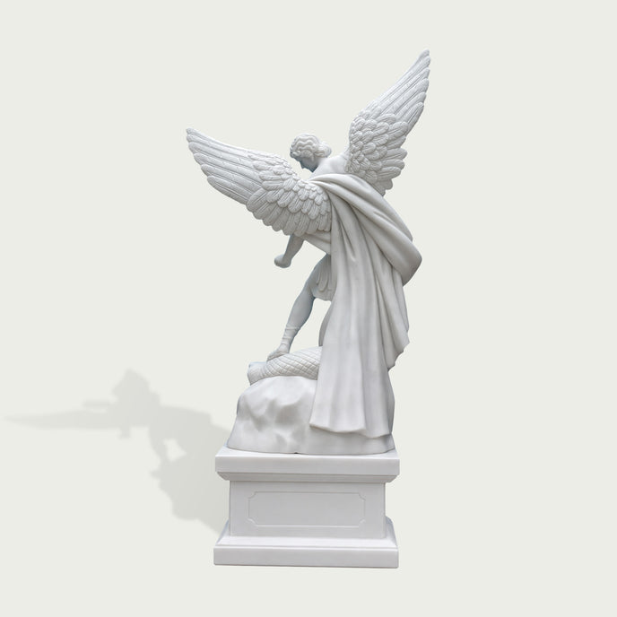 Rear view of white marble Saint Michael angel statue showing large feathered wings, flowing cloak details and handcrafted stone sculpture finish.