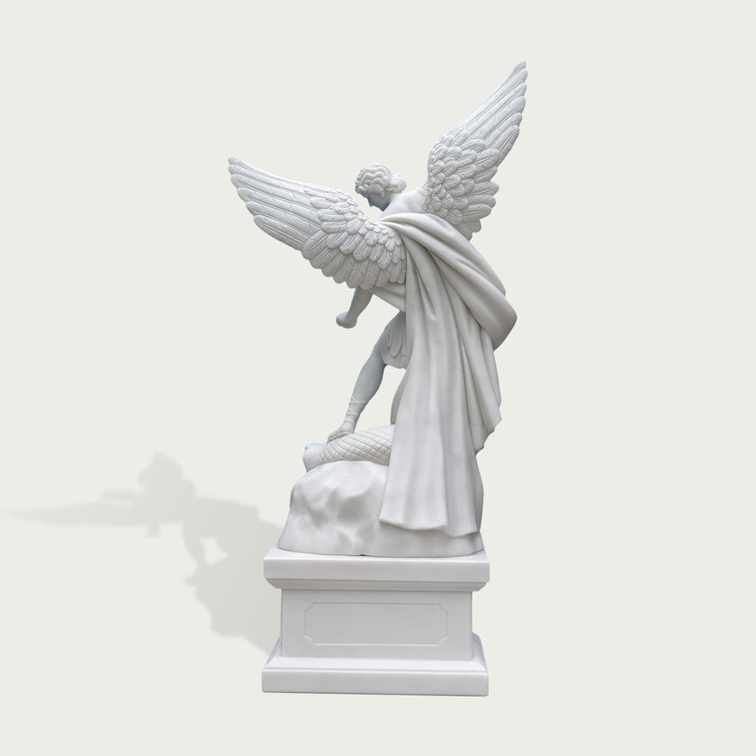 Rear view of white marble Saint Michael angel statue showing large feathered wings, flowing cloak details and handcrafted stone sculpture finish.