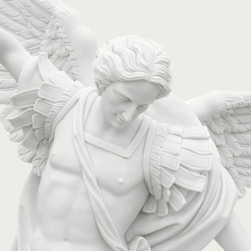 Close-up of white marble Saint Michael the Archangel statue showing facial expression, carved hair, wings and elegant Renaissance-inspired details.