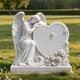Outdoor white marble angel memorial statue with heart shaped tombstone, carved rose flowers, cross detail and realistic feather textures, showcasing premium handcrafted marble finish.