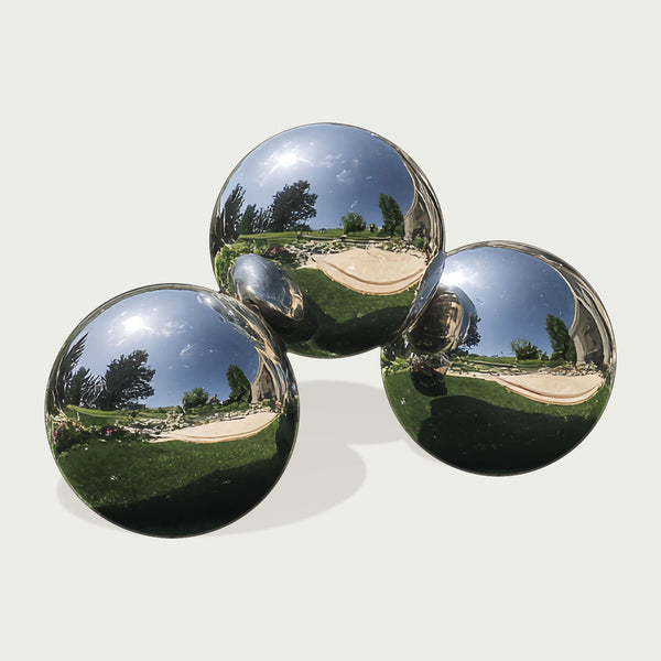 Three large stainless steel spheres