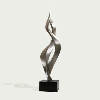 Modern tewsting silver stainless steel sculpture  on a white background