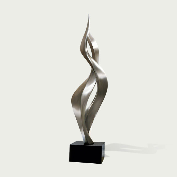 Soaring Ribbon Twisting Stainless Steel Sculpture on a black base against a white background