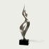 Soaring Ribbon Twisting Stainless Steel Sculpture on a black base against a white background