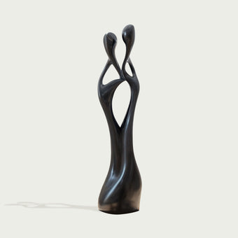 Black Abstract Intertwined Lovers Stainless Steel Sculpture on a white background
