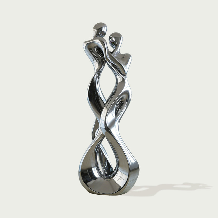 Abstract Embracing Lover Stainless Steel Sculpture  on a light gray background