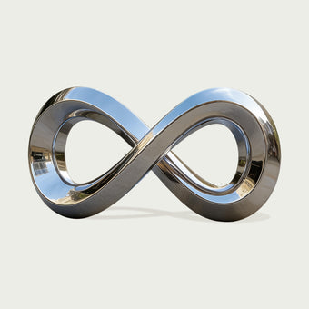 Giant Mobius Strip Mirror Polished Outdoor Stainless Steel Sculpture on a light gray background