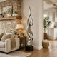 Large Mirror Polished Spiraling Wave Statue in a living room setting.