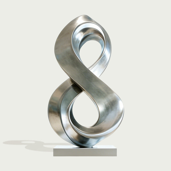 Fluid Infinity Loop Stainless Steel Sculpture on a light gray background