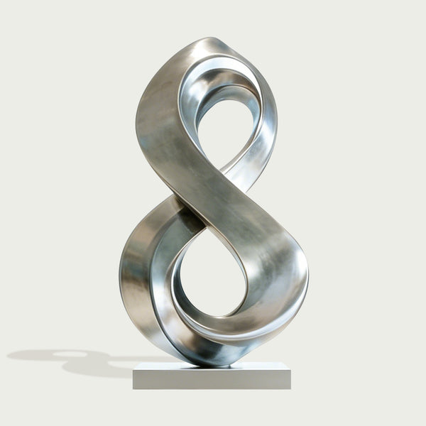 Fluid Infinity Loop Stainless Steel Sculpture on a light gray background