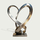 Stainless Steel Sculpture Ascending Heart on a light gray background