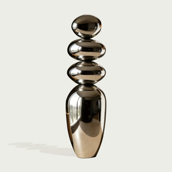 Mirror Polished Balancing Stone Stainless Steel Sculpture on a white background