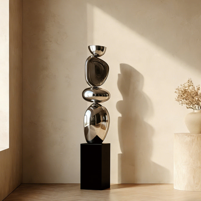 Stainless Steel Irregular Balancing Floor Sculpture in a corner of a minimalist living room 