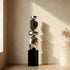 Stainless Steel Irregular Balancing Floor Sculpture in a corner of a minimalist living room 
