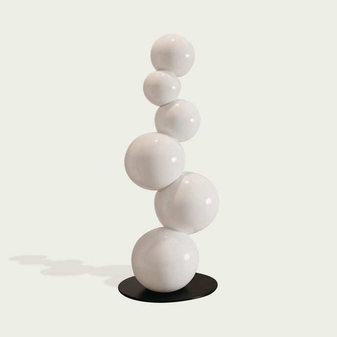 Abstract Floating White Balls Stainless Steel Sculpture  against a light gray background