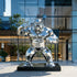 Geometric Gorilla Stainless Steel Sculpture Animal Sculpture in front of a modern building
