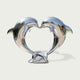 Romantic Heart Shaped Leaping Dolphins Stainless Steel Sculptures on a white background