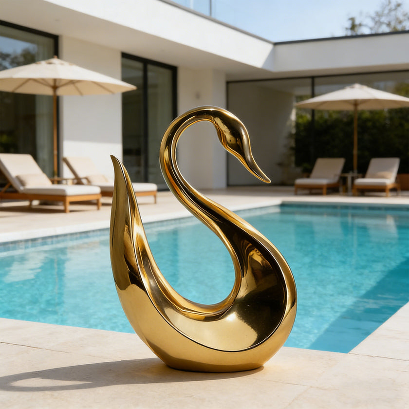 Fluid Silhouette Swan Modern Contemporary Stainless Steel Sculpture by a poolside in a luxury modern house