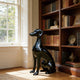 Gleaming Seated Dog Black Statue in a reading room of a luxury house