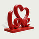 Charming LOVE Lettering Stainless Steel Floor Sculpture on a matching rectangular red base against a light gray background.
