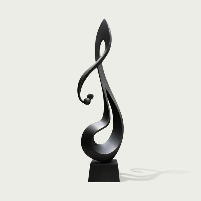 Lyrical Musical Note Black Stainless Steel Sculpture on a rectangular base, photographed against a plain light gray background.