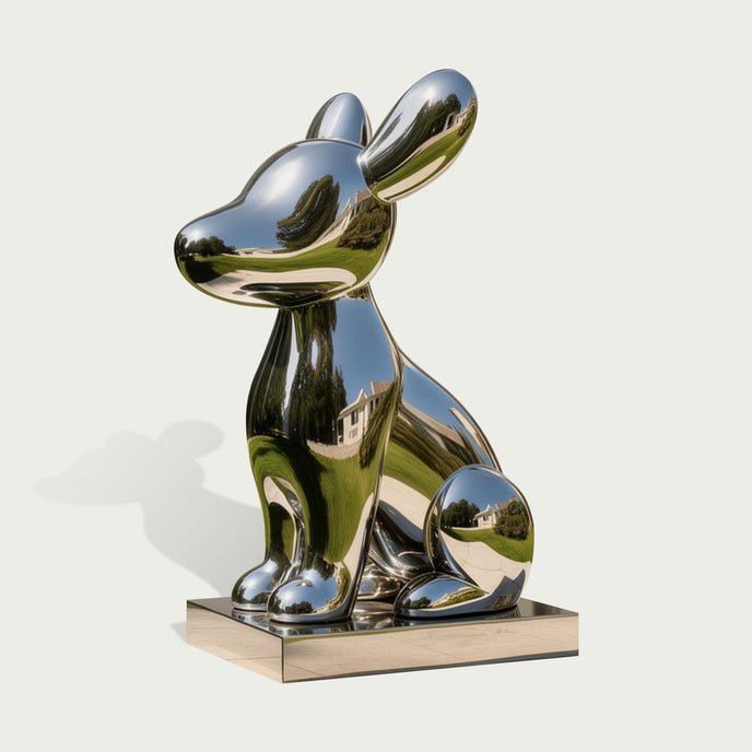 Adorable Cartoon Puppy Outdoor Stainless Steel Sculpture sitting on a rectangular metallic base, photographed against a plain light gray background.