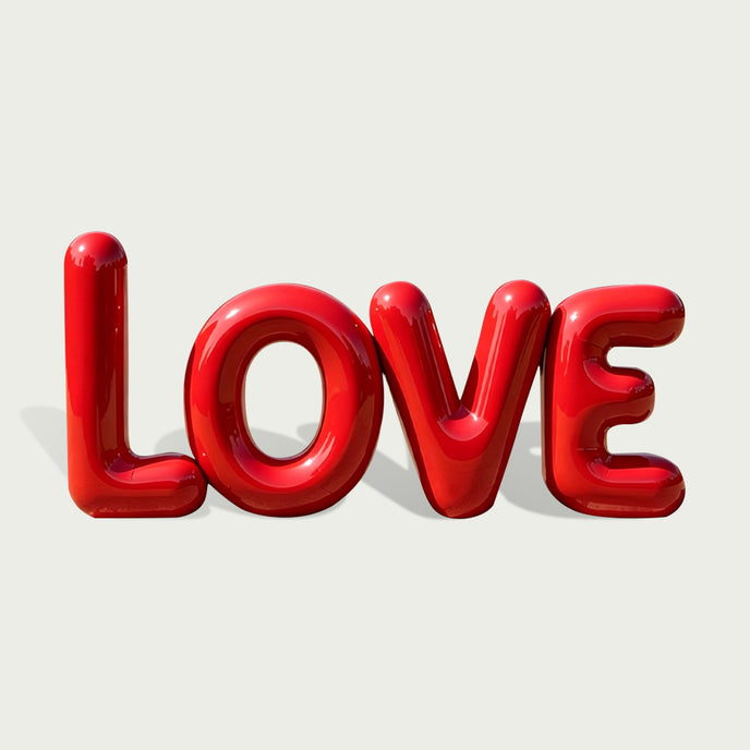 Balloon Style Red LOVE Custom Stainless Steel Sculpture LOVE on a light gray background.