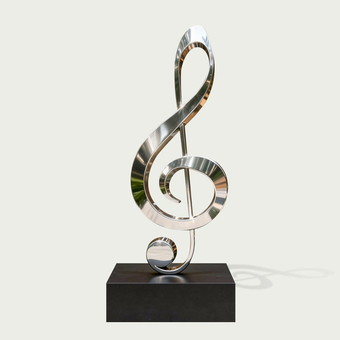 Modern Musical Note Outdoor Stainless Steel Sculpture on a rectangular black base, photographed against a plain light warm-gray background.