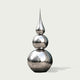 Striking Teardrop Tower Outdoor Stainless Steel Sculpture reflective spheres and a teardrop-shaped finial, shown on a plain light gray background.