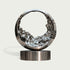 Mesmerizing Tidal Circle Abstract Stainless Steel Sculpture of a ring with a textured, liquid-like interior, mounted on a cylindrical base against a light gray background.