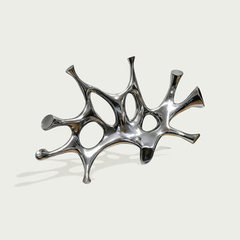 Modern stainless steel abstract wall sculpture with organic flowing shapes and polished reflective surface, handcrafted contemporary metal artwork with mirror finish.