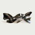 Polished stainless steel wall sculpture with flowing ribbon-like curves and reflective surfaces, displayed above a console table in a modern luxury interior.