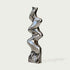 Vertical Liquid Ripple Abstract Stainless Steel Sculpture with a highly reflective, wavy metallic surface, standing on a square base against a light gray background.