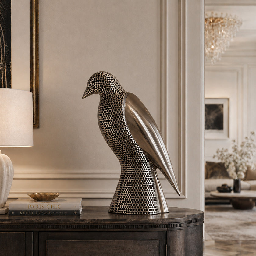 Perforated Texture Bird Mirror Polished Stainless Steel Sculpture on the entrance table in a luxury modern villa