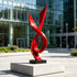 Modern Red Fluid Art Stainless Steel Sculpture on a shopping plaza