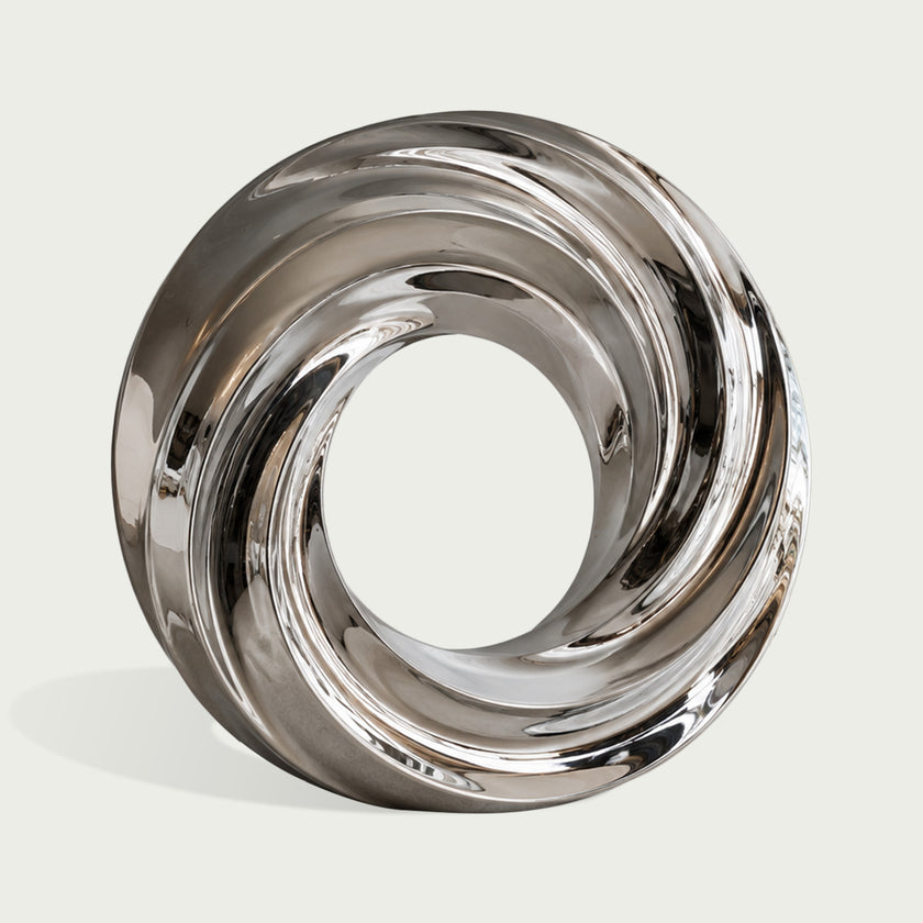 Swirling Vortex Ring Mirror Polished Stainless Steel Sculpture on the white background