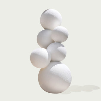 Stacked White Spheres Stainless Steel Sculpture on a white background